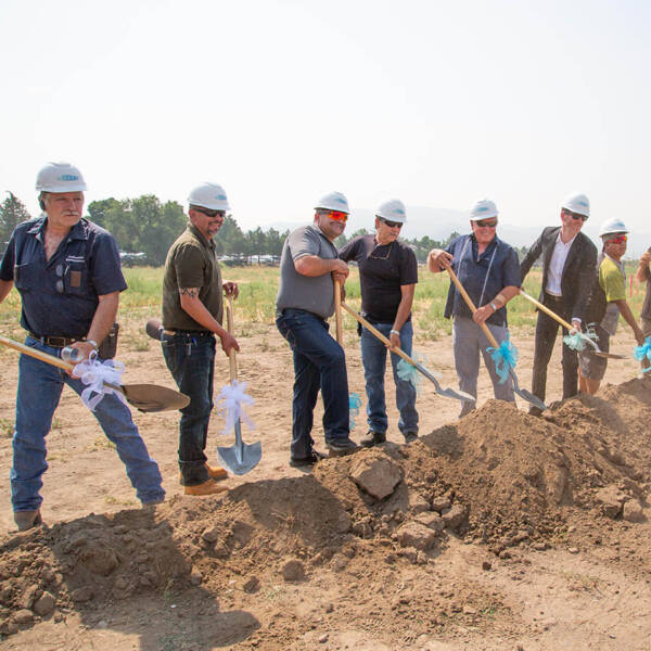 Oakmont team with shovels breaking ground at Azure apartments.