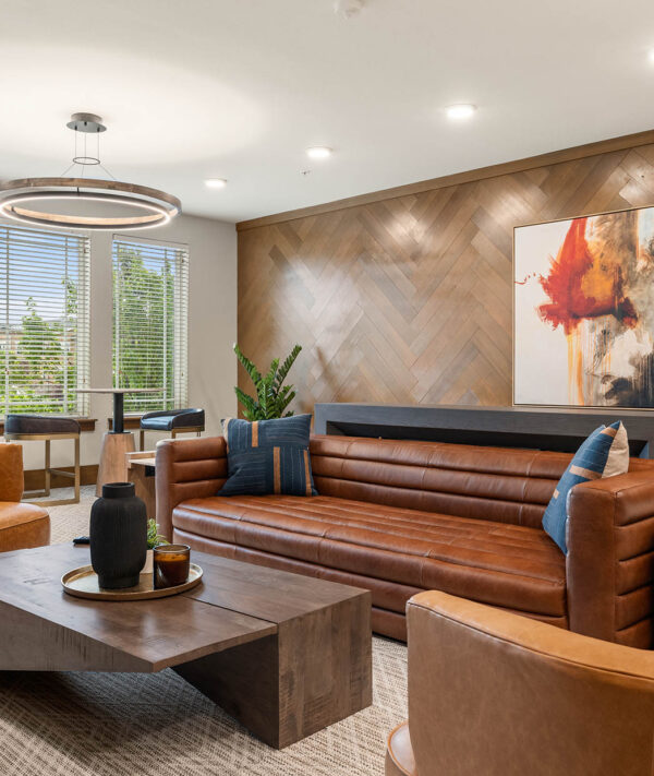 Caliber resident lounge with leather couch and decor.
